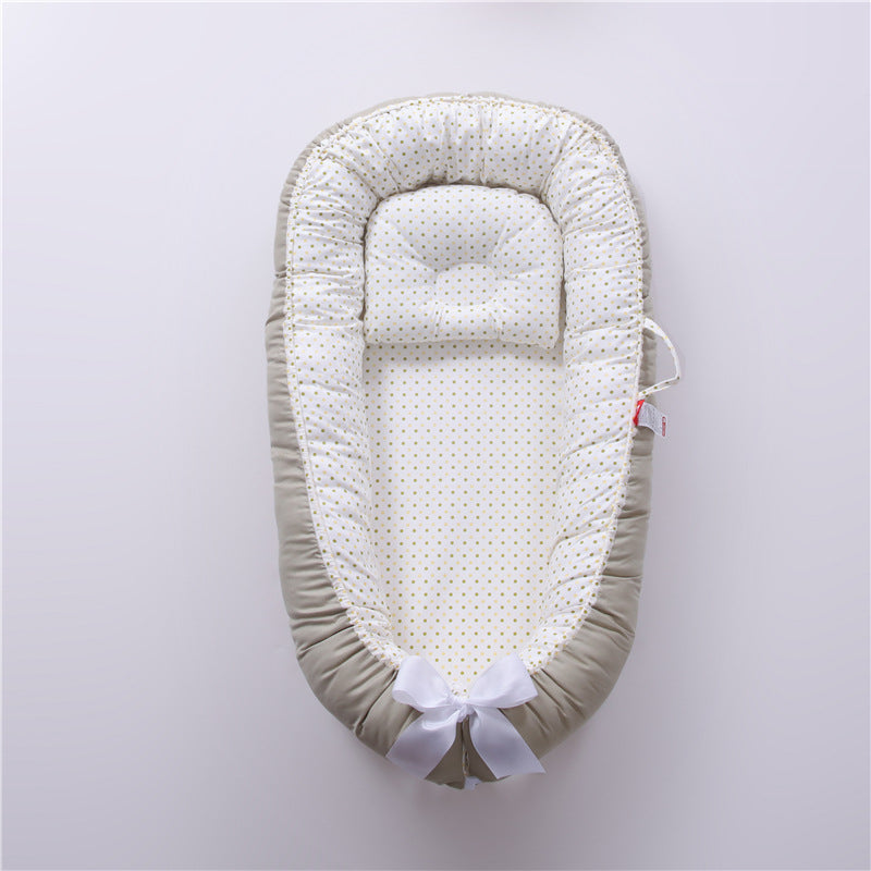 Nid réducteur de lit bébé avec coussinet ergonomique