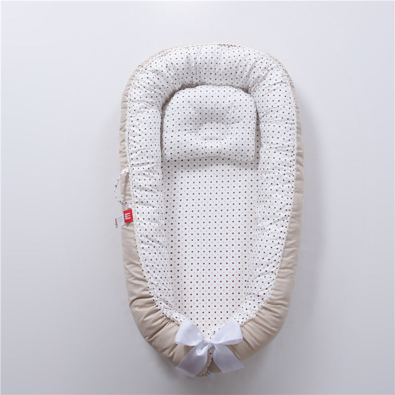 Nid réducteur de lit bébé avec coussinet ergonomique