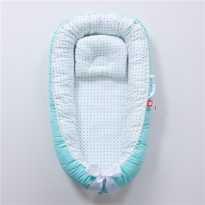 Nid réducteur de lit bébé avec coussinet ergonomique